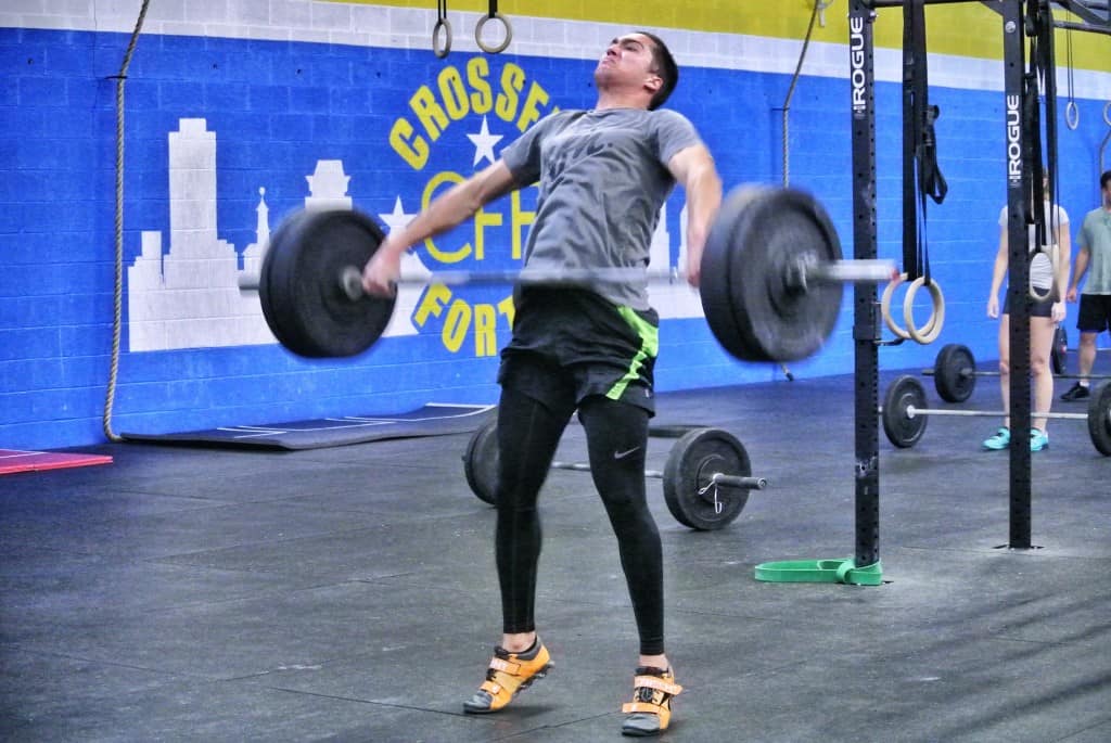 Troy demonstrating the triple extension (hips, knees, ankles) in the snatch